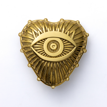 Gold decorative adored amulet door knocker on a white background